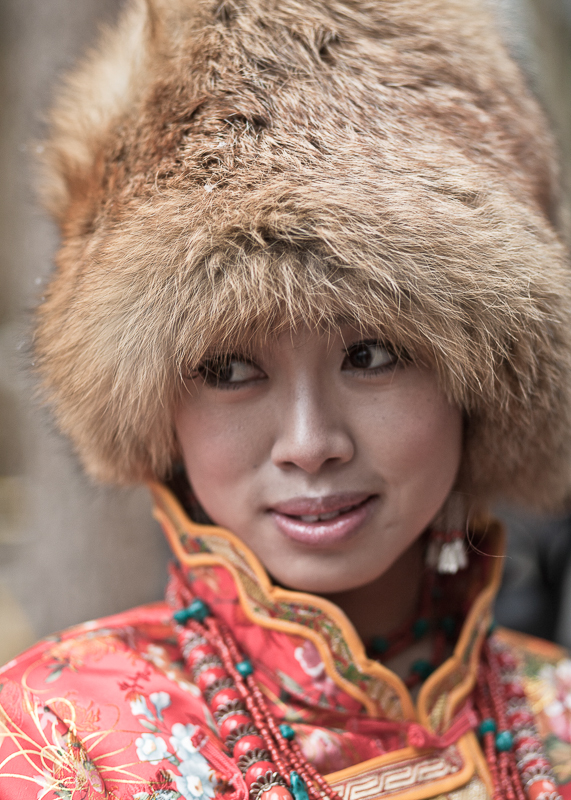 Young lady in traditional dress, Jiuzhaigou