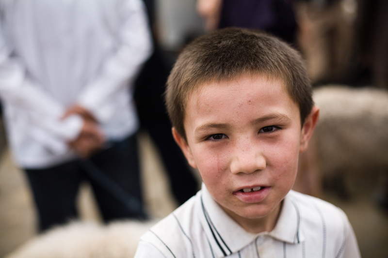 A young boy at the livestock market, Kashgar, 2008.